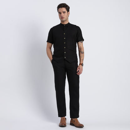 Men’s black linen waistcoat featuring a deep V-neckline and six-button closure